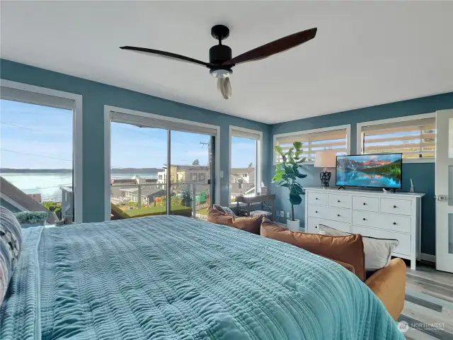 Primary bedroom with exterior deck with sound view.