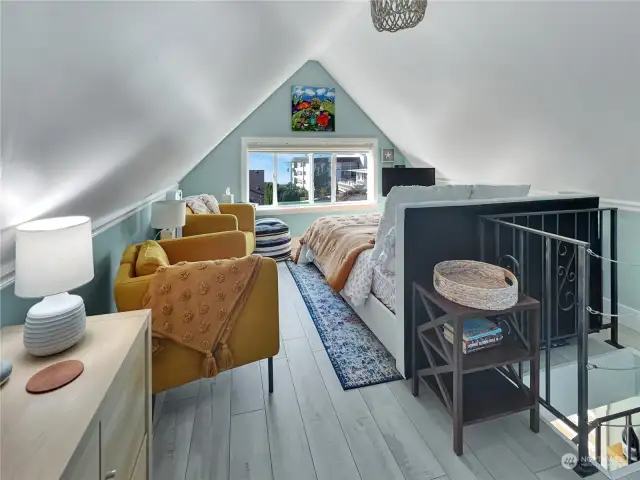 Upstairs ADU bedroom with sitting area with sound view.