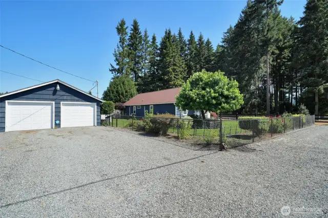 Extra large two car garage with storage and workshop, plenty of parking, grass has been retouched