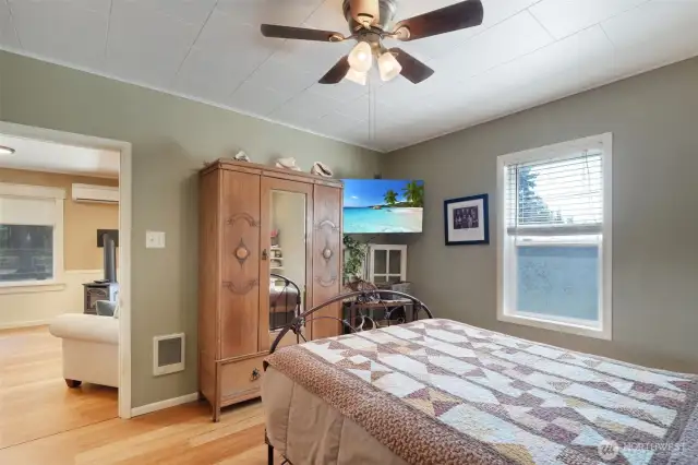Bedroom at front of home with ceiling fan