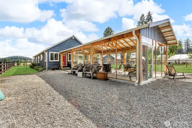 Rear look at covered and enclose patio, grass has been retouched