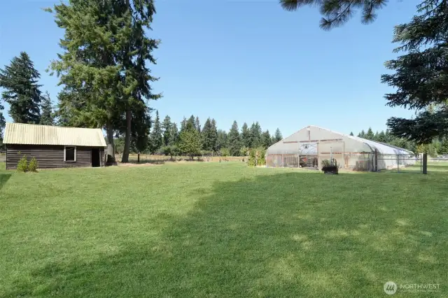 Original homestead on left, possible farm stand, 30 x 96 greenhouse on right with frost free spigots, plumbing and wash basins that drain to septic, grass has been retouched