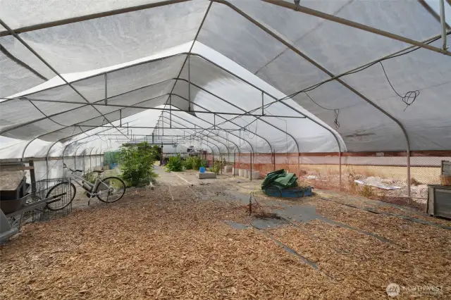 Inside greenhouse with frost free spigots and plumbing that drains to septic