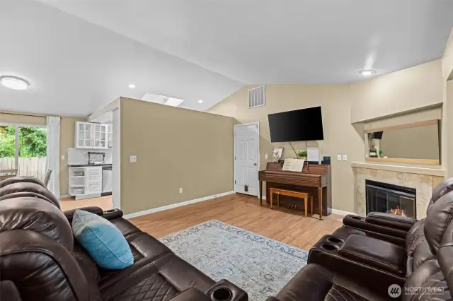 Vaulted ceiling over living room and kitchen.