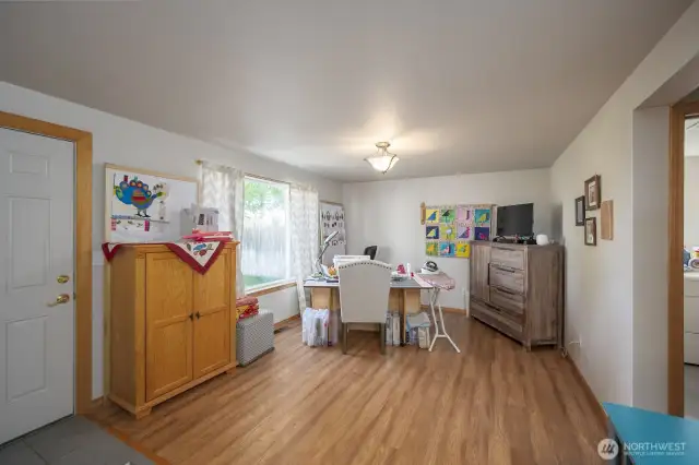 Family room currently used for sewing area