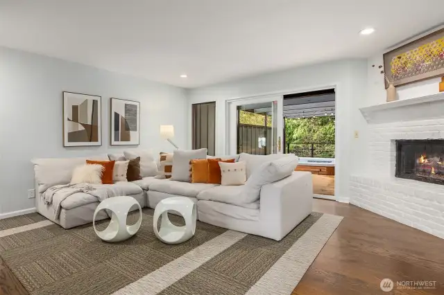 The family room, conveniently located off the kitchen, offers seamless access to the back deck for more easy indoor-outdoor living.