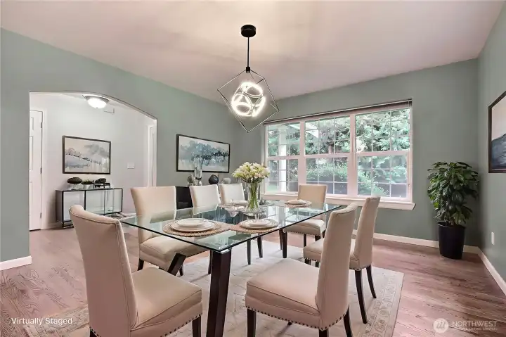 As you enter the home, you will find your formal dining room on the left. I love the large windows throughout this home, the beautiful flooring and updated light fixtures! ***Virtually Staged***
