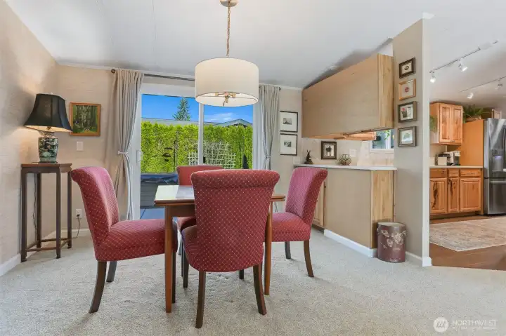 Formal Dining room opens to the living room and eating bar to the kitchen.  Sliding door access to the back patio and private courtyard.