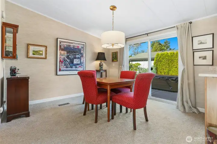 Formal Dining room opens to the living room and eating bar to the kitchen.  Sliding door access to the back patio and private courtyard.