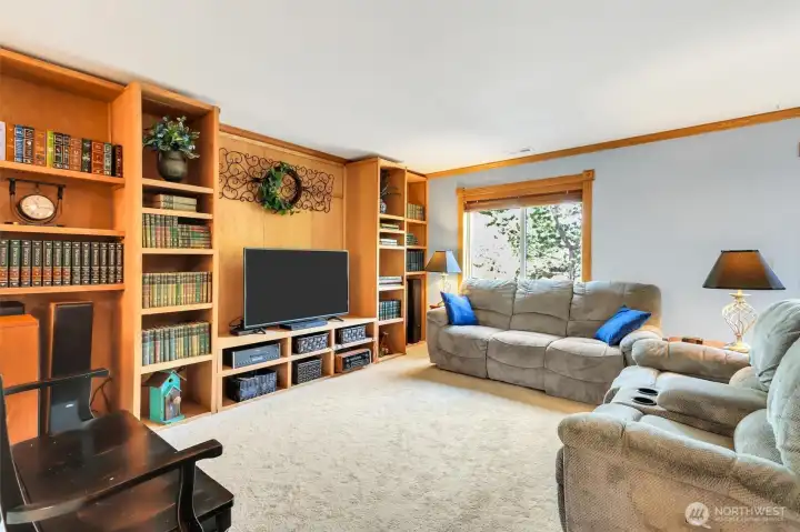 The family room features an amazing bookcase/entertainment area.