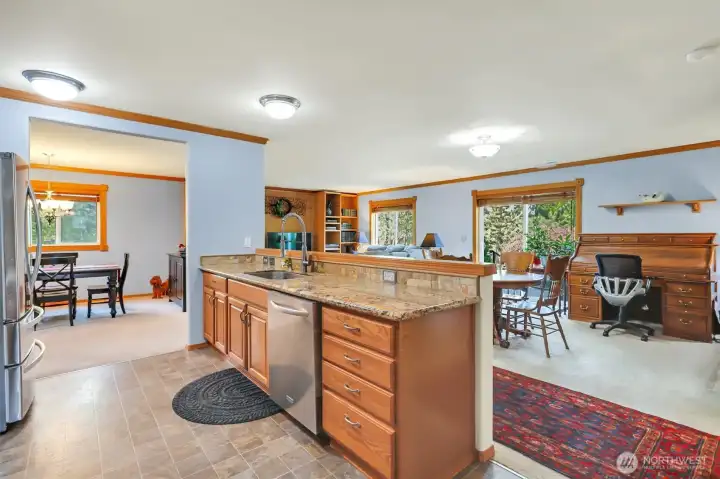 Open to the dining room and family room, you'll never miss a thing when entertaining!