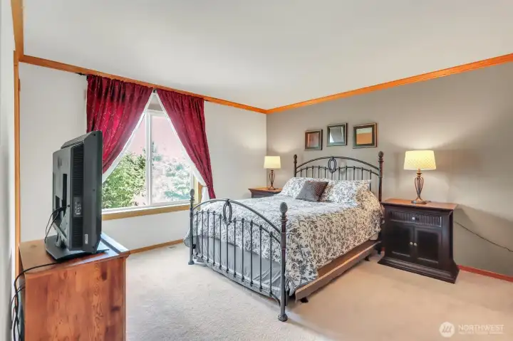 This bright bedroom offers plenty of sunlight
