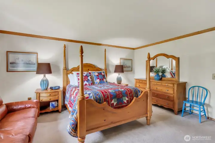 The generous sized primary suite is large enough to fit the large bedroom furniture, but a sofa as well!