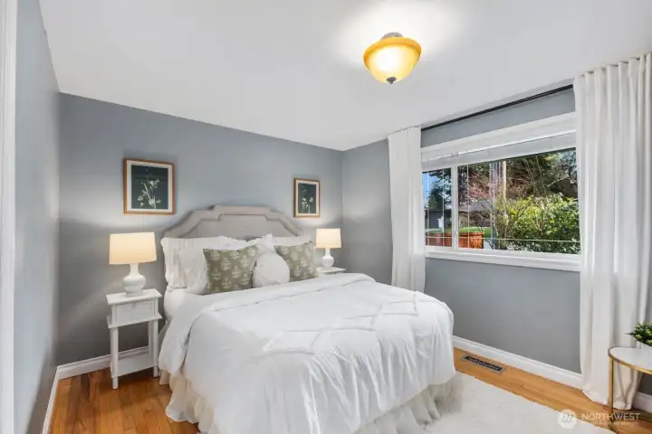 Bedroom with neutral finishes, window for natural light, and closet storage. Provides a comfortable and private sleeping area.