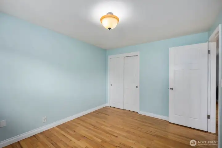 Additional room with hardwood floors, painted walls, and window for natural light. The flexible layout works well as a bedroom, home office, hobby room, or other everyday living space.