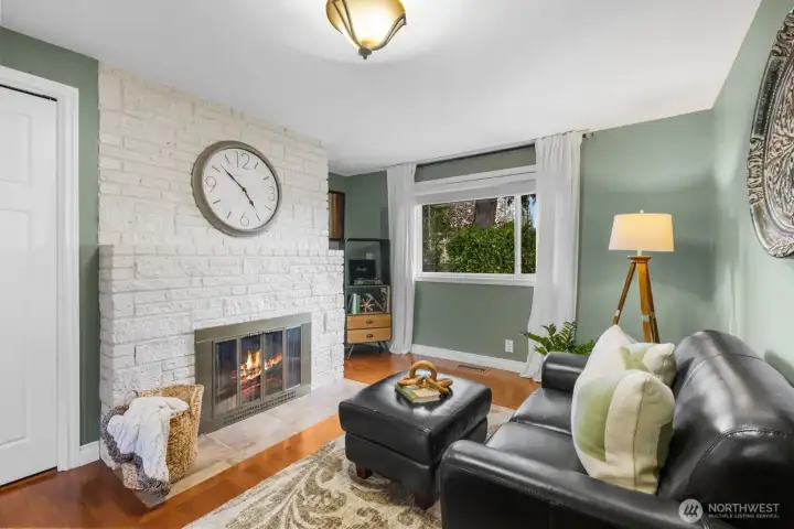 Additional living area with fireplace and natural light. Suitable for flexible use including sitting room or secondary lounge.