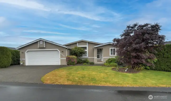Beautifully mature landscaping adds curb appeal to 8045 18th Lane