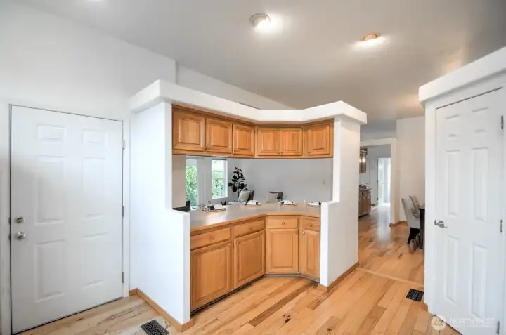Casual counter top seating with more cabinets above and below