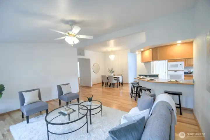 View of the family room, countertop seating and designated dining area