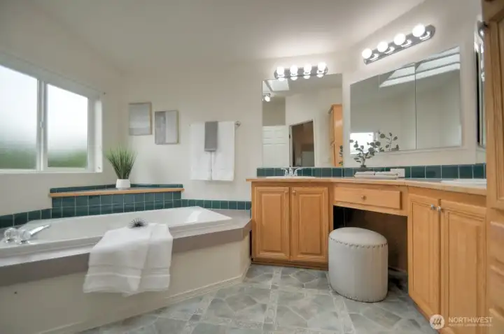 Primary ensuite with soaking tub, double sinks and vanity
