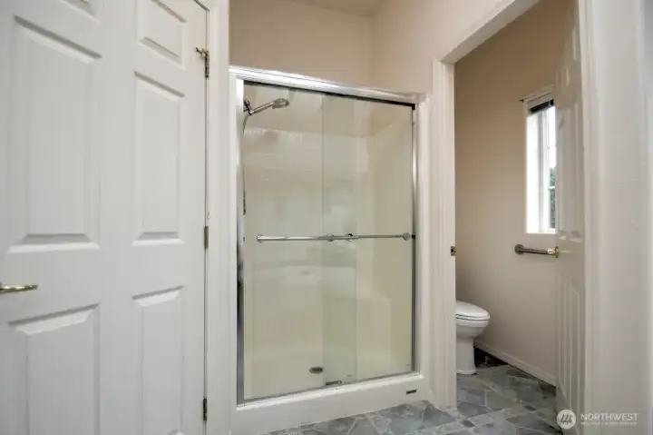 Primary ensuite walk-in shower and commode
