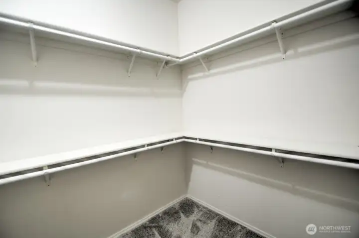 Primary bedroom walk-in closet