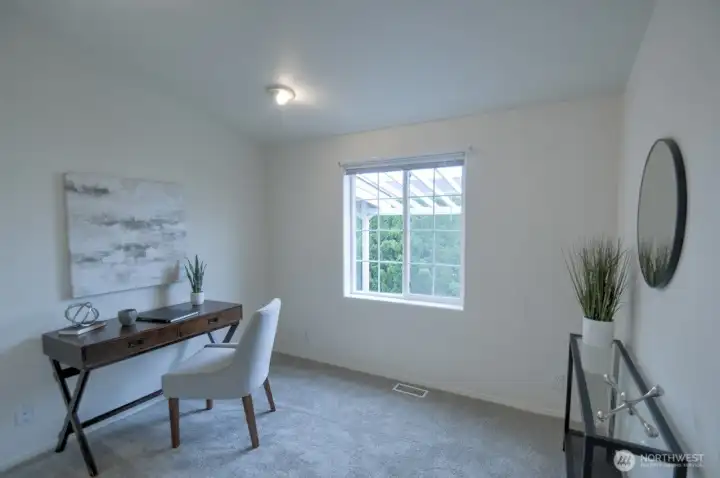 One of two additional bedrooms staged as an in-home office