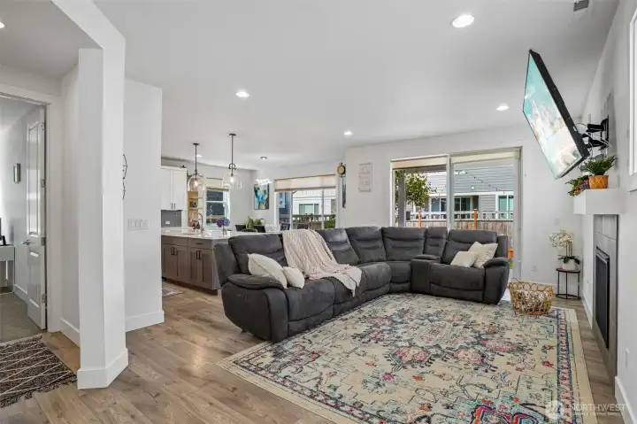 Large windows bring in abundant natural light, creating a warm and welcoming atmosphere