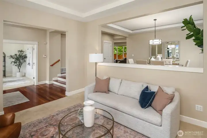 Living room with view up to formal dining room
