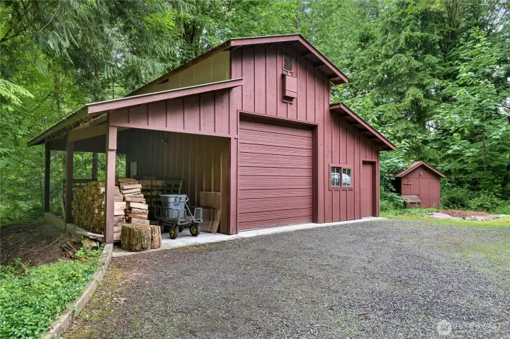 24' X 30' Shop with tall vehicle door and space for wood or extra storage. Well house on the right 24' X 30' Shop with tall vehicle door and space for wood or extra storage. Well house on the right
