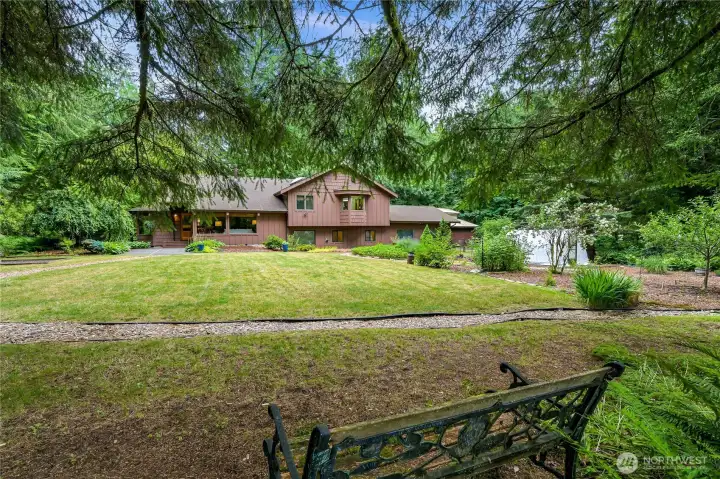 Contemplate life from your backyard, between the house and a neighboring forested area that cannot be built on Contemplate life from your backyard, between the house and a neighboring forested area that cannot be built on