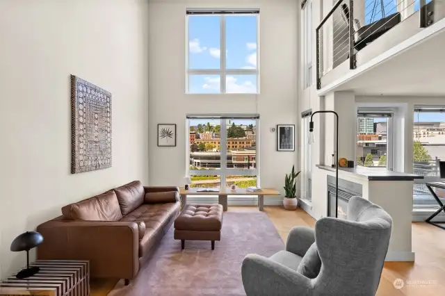 Beautiful loft-style luxury includes a breathtaking view of Union Station and Downtown city lights. Stylish hardwood floors open the spaces, set off by a gas fireplace.