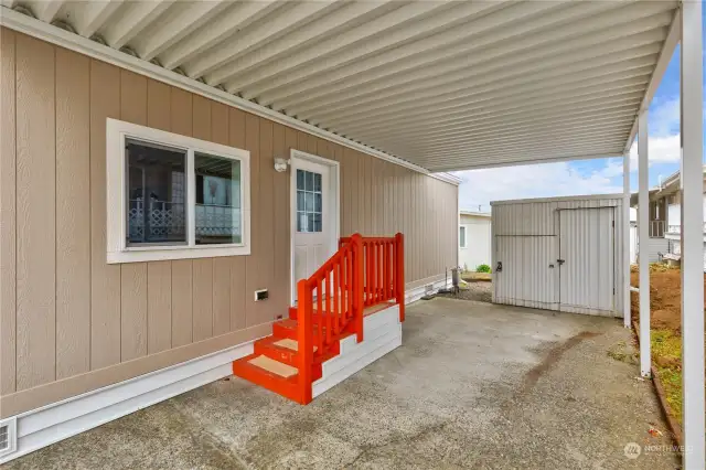 Carport with storage shed