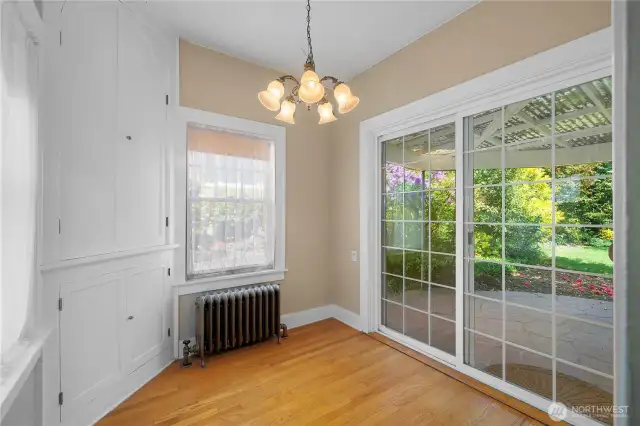 Eating area off kitchen with patio.