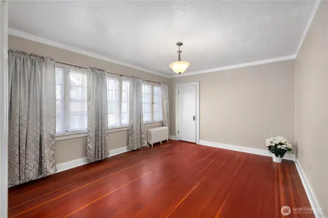 Large upstairs bedroom with walk-in closet and a wall of windows.