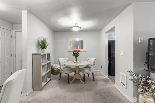 Dining space between living room and kitchen.