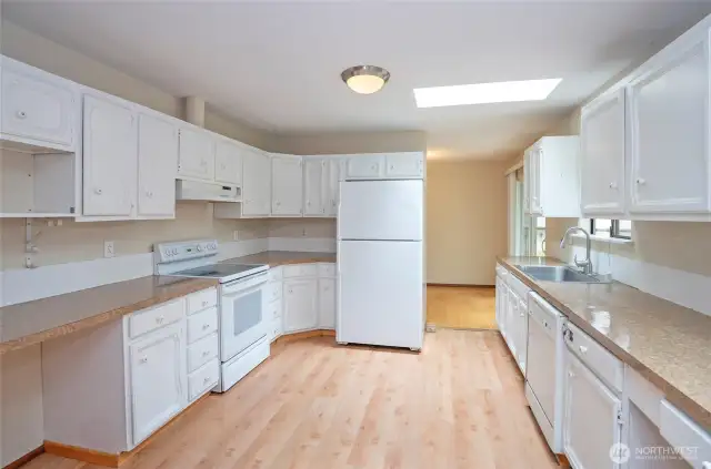 Bright kitchen with two skylights.