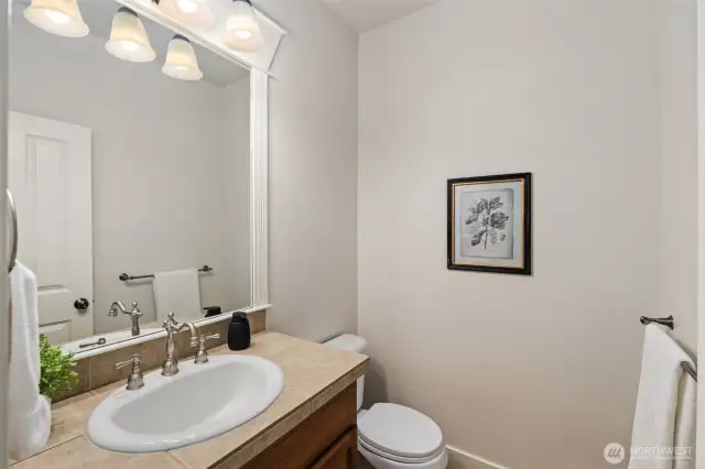 Main level half bathroom.