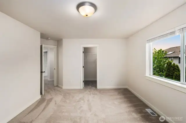 Guest bedroom 1 comlete with fresh paint + new carpet + walk in closet.