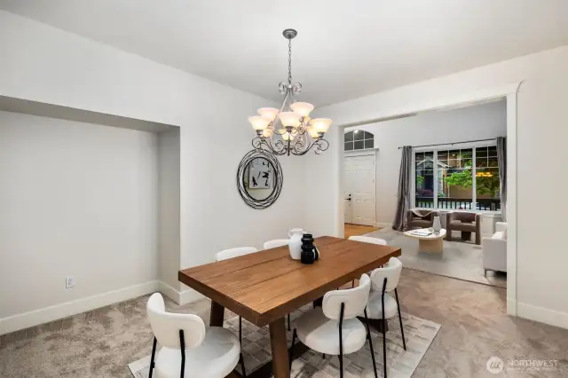 Formal dining room with an attached butler's pantry area.  Notice the space for additional furnishings?  Lots of room for a buffet piece or dispay area.  So much space in here for an even larger dining table.  Amazing space!