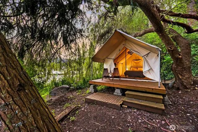 The ultimate outdoor experience: your private lakeside clamping tent on an elevated platform: dim the chandelier and stargaze, while you drift to sleep.