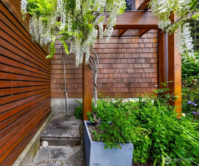No need to head indoors to rinse off - use your outdoor shower, draped in Wisteria.
