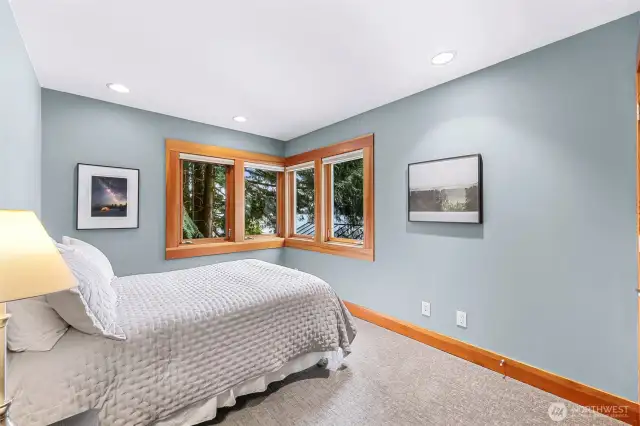 Upstairs bedroom with corner windows.