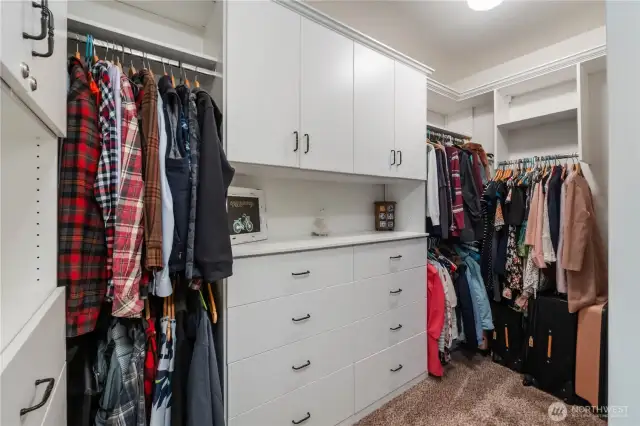 Dream closet in the primary bedroom is larger than pictured and finished with a closet system by ClosetsbyDesign.