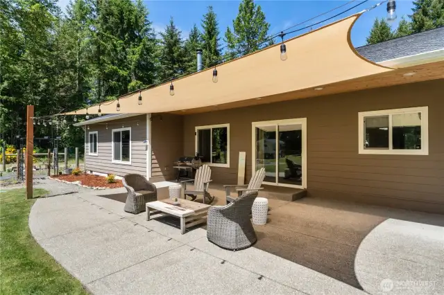 Watch the sunset from your oversized patio with cover, recessed lights and whimsical solar lights.