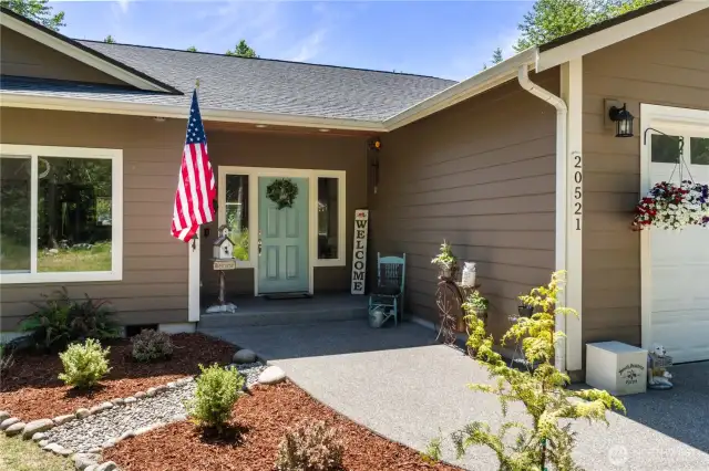 Covered front porch greets you upon entry.