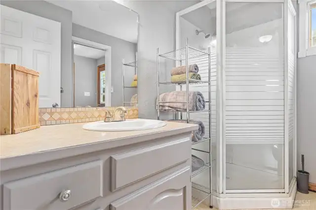 Primary bath with walk through to laundry room.