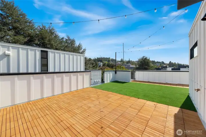 Roof top deck looking South towards Genesee Hill. Pet friendly turf.