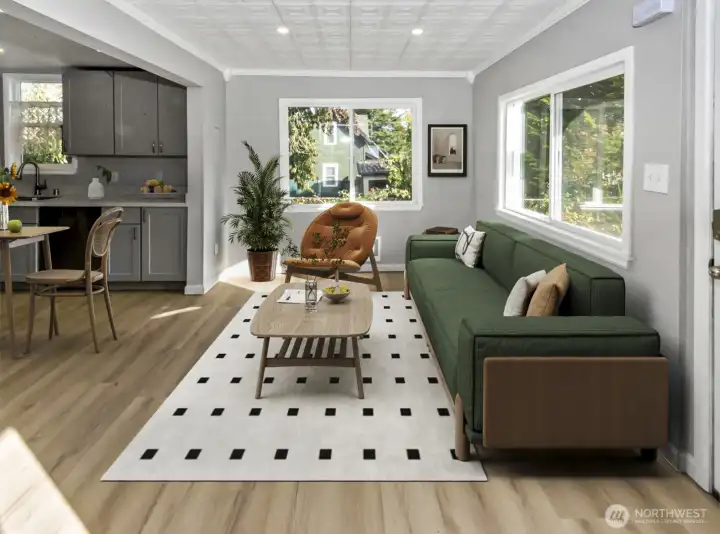 Virtually Staged. Living room off of main entry leading into kitchen. Brand new vinyl plank flooring recently installed this month that is the same throughout the whole house.