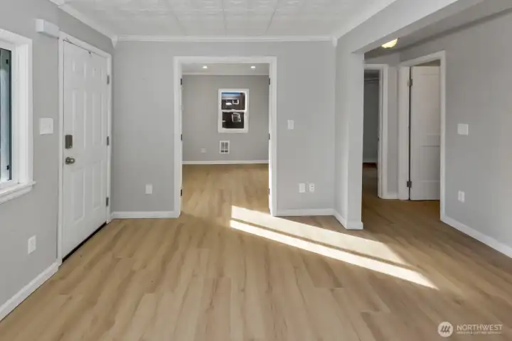 Non staged living room photo looking into office/bonus room